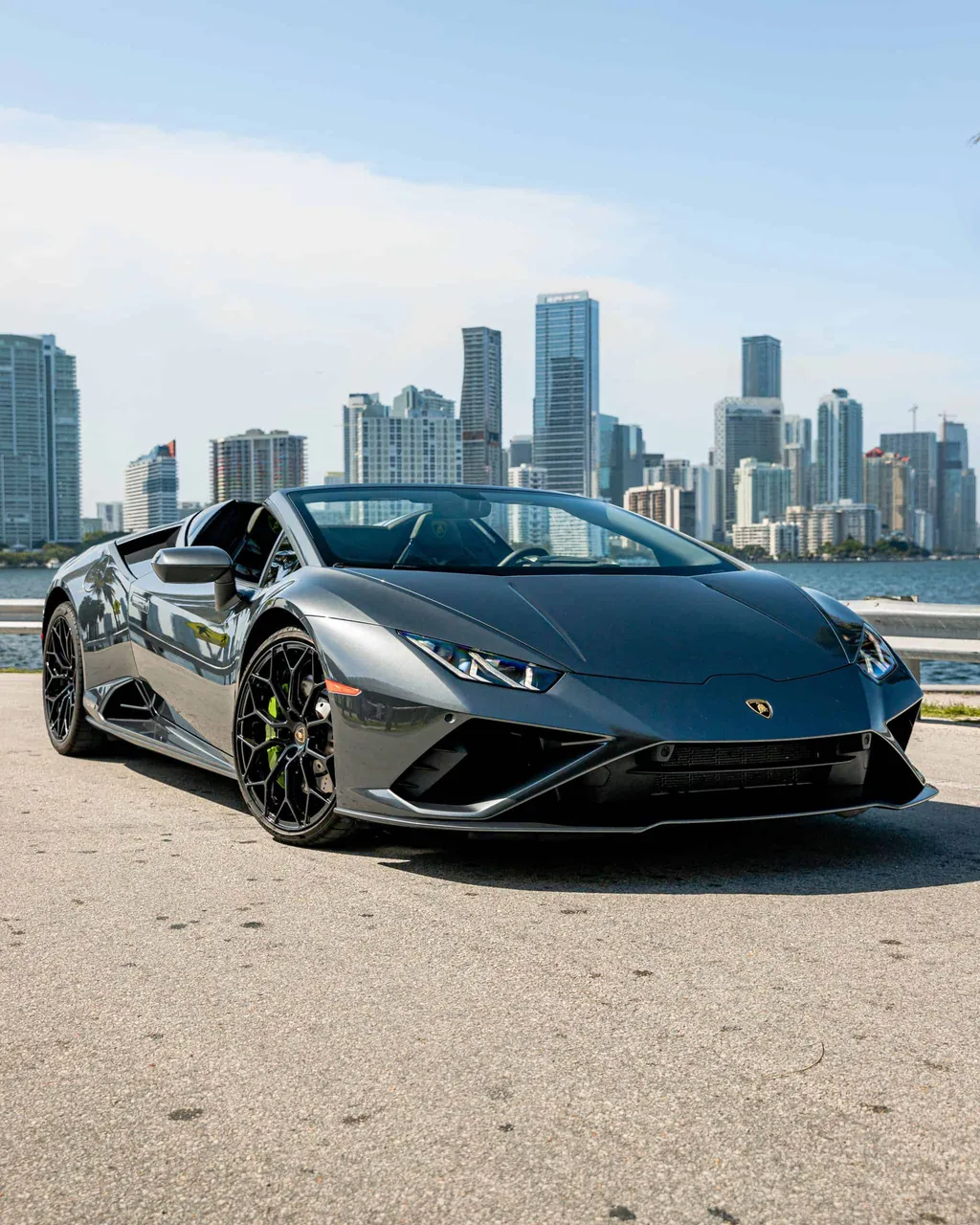 Grey Lamborghini Huracan EVO Spyder delivered against the Miami skyline